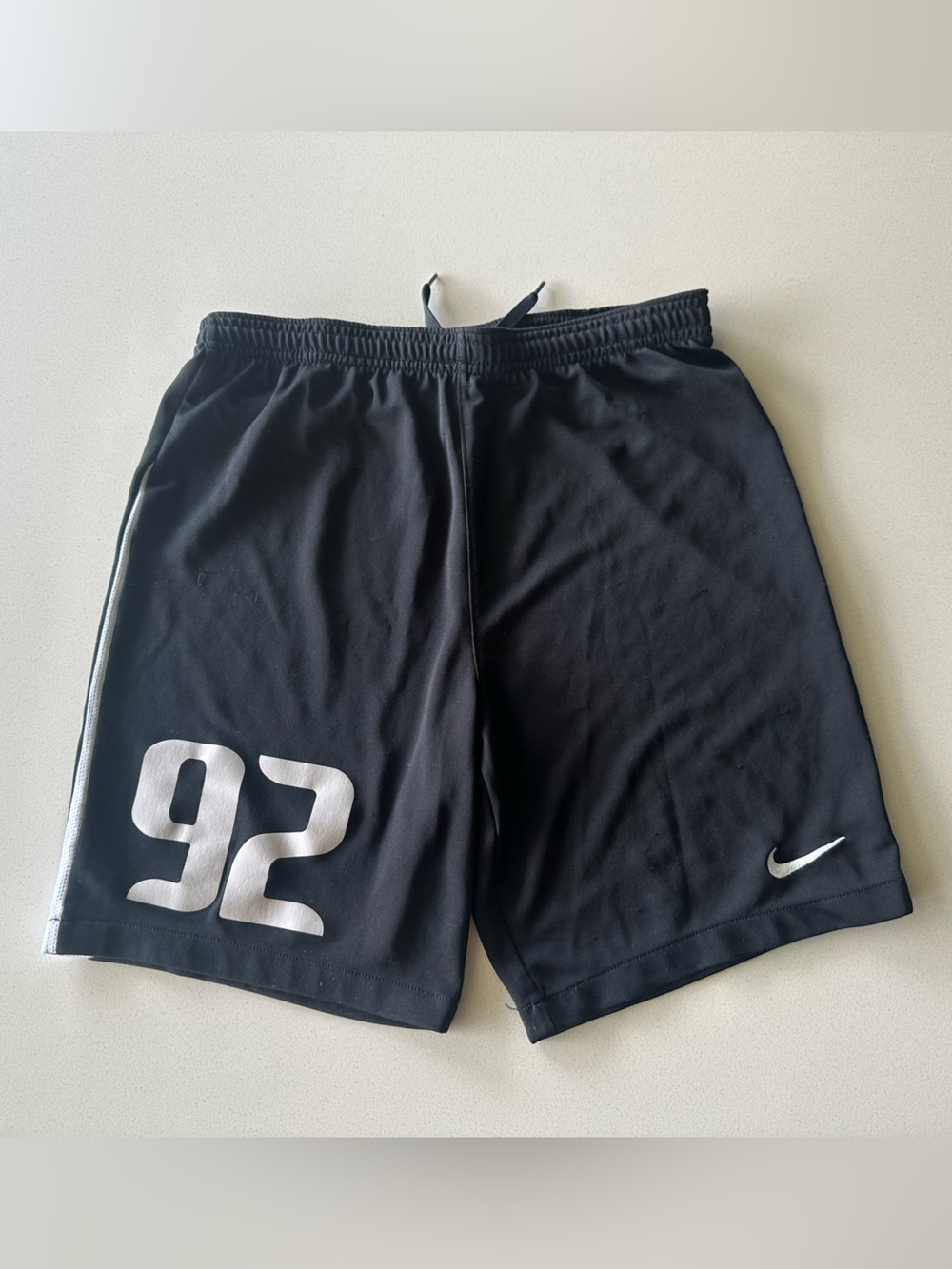 Nike Men’s Black Athletic Shorts with White Number and Swoosh